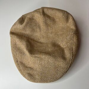 Stetson vintage flat cap featuring a prominent tan and cream herringbone tweed p